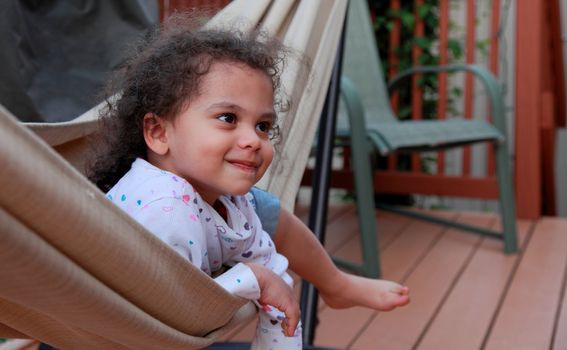 happy little girl in hammock