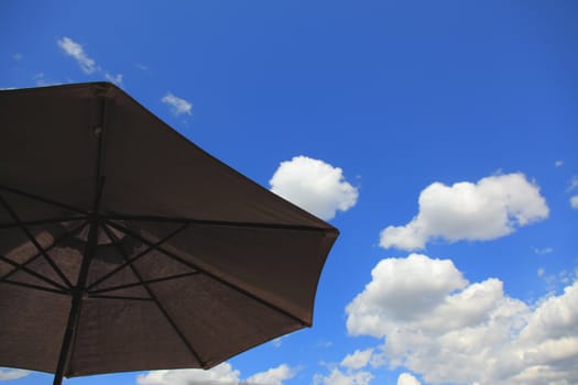 umbrella against blue sky with copy space