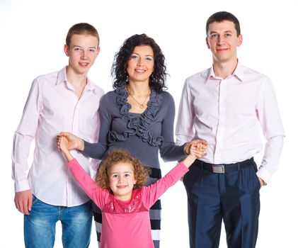 Portrait of happy Caucasian family smiling together on white background