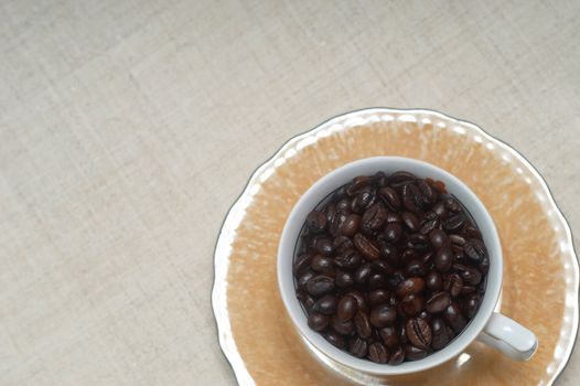 Still life of coffee grains and pieces of service