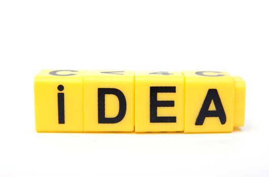 An image of yellow blocks with word ''idea'' on them