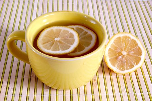 A cup with tea and lemons