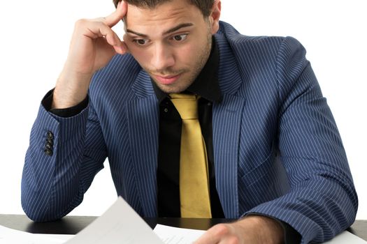 Young stressed overwhelmed businessman wearing a suit and golden tie