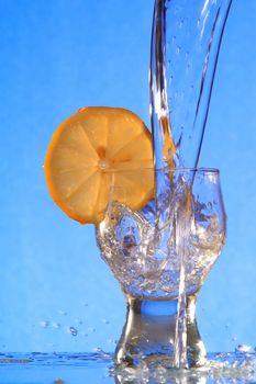 A glass with a drink splashing about