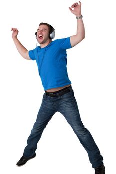 Young Man Listening to music and jumping in the air