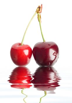 An image of two red berries in a water