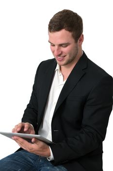 Young Businessman in jeans working on a tablet pc