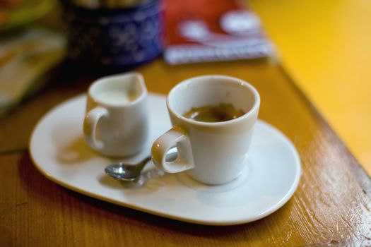 An image of a cup of coffee and cream