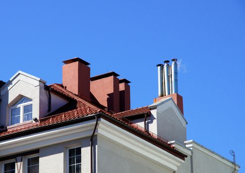 The roof and chimney with blue sky