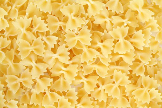 An background of uncooked pasta macro view