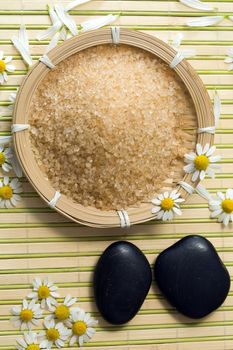 An image of bathing salt and stones for spa massage