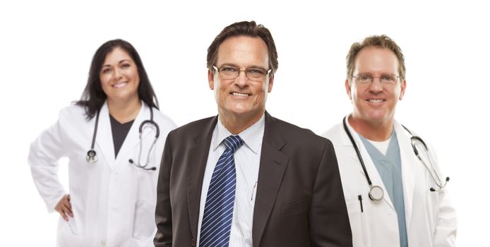 Handsome Businessman with Medical Female and Male Doctors or Nurses Behind Isolated on White.