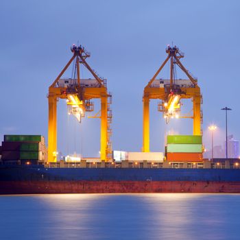 Container stacks and crane in shipyard at dusk for cargo Goods and Logistic background