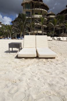 A pair of beach lounge chairs