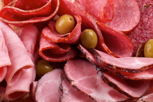 Background of Assorted Meat delicatessen and olives