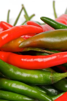 Arrangement of Fresh Red and Green Chili peppers closeup