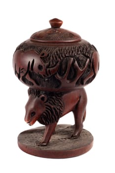 An antique African antique made of wood handmade by African tribes, of a lion with a container on it, on white studio background.