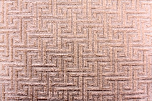 A background of a fabric with an abstract design on it.