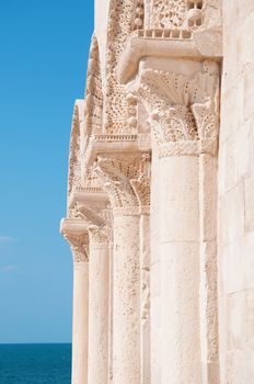 detail of old architecture and blue sea background