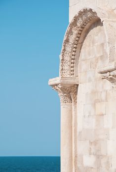 detail of old architecture and blue sea background