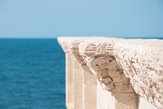 detail of old architecture and blue sea background