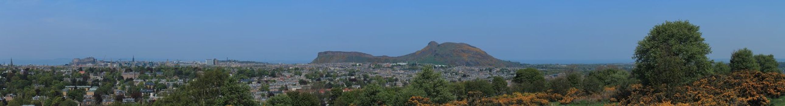 View of Arthur's Seat and the city of Edinburgh. This photo is made attaching together various photos