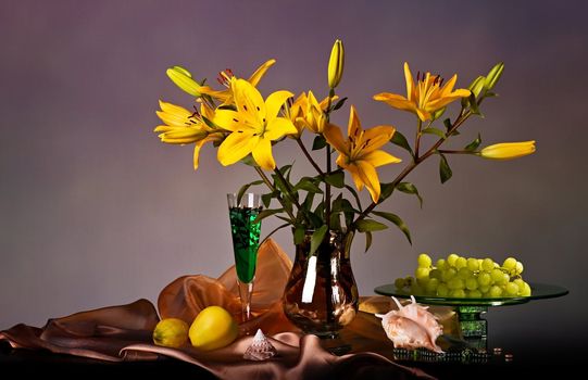 Still life with yellow lily and fresh fruits 