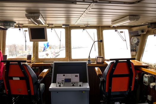 A modern NATO warship command bridge wheelhouse