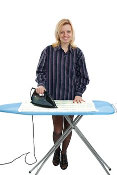 smiling housewife dressed in men's shirt ironing clothes