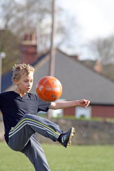 teenage boy enjoying a game of football