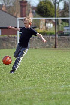 teenage boy enjoying a game of football