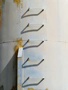 Iron ladder steps of metal fodder fermenting silo storage tank