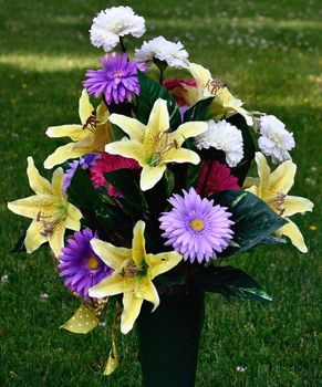 Flower Bouquet arrangement in a vase in a cemetery.