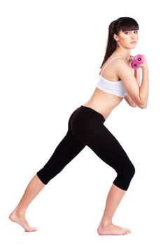 Young woman doing fitness exercises with two weights, isolated on white