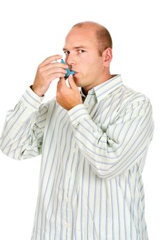 Man holding asthma medicine inhaler with both hands