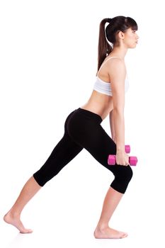 Young woman doing fitness exercises with two weights, isolated on white