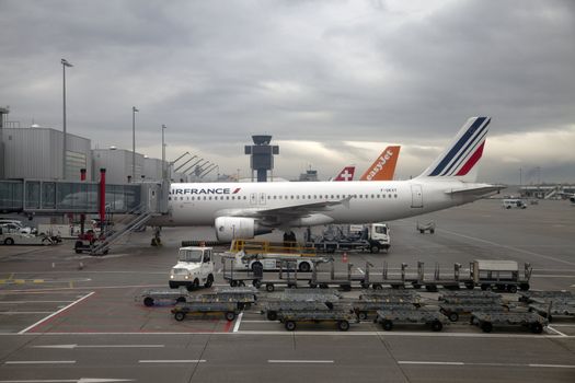 Airplanes being loaded at terminals in Geneva airport.
Photograph taken January 19, 2012 at Geneva International Airport, Geneva, Switzerland