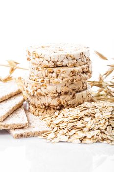 Various dietary oat products on white background