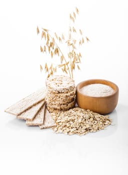 Various dietary oat products on white background