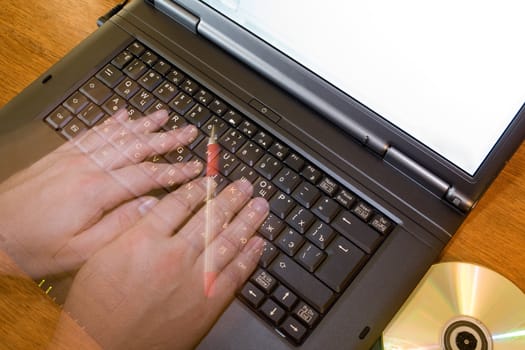 An image of hands on black keyboard