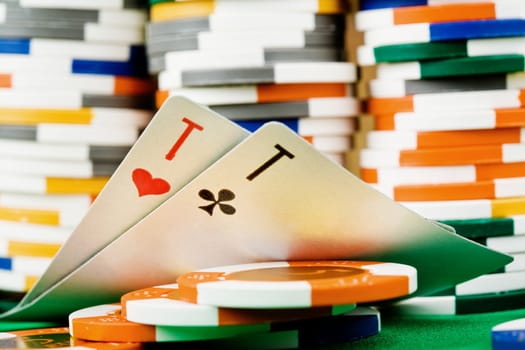 Two cards and heap of poker chips