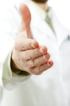 An image of a doctor stretching his hand out