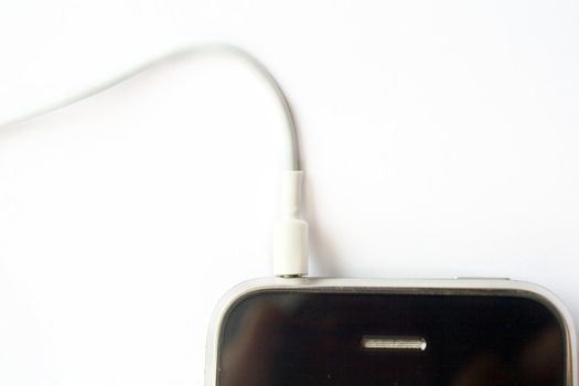 An image of a white cord in mobile phone