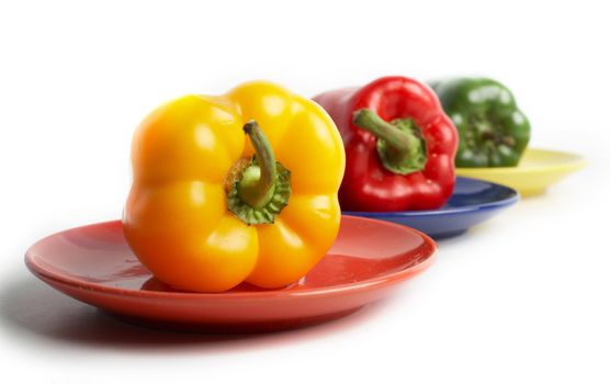 An image of color peppers on a saucers