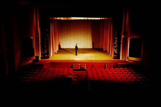 Stock photo: an image of man on the stage in empty hall