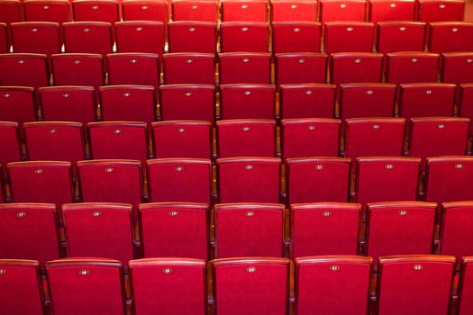 Stock photo: an image of many rows of red chairs