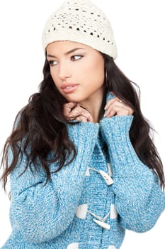 portrait of a young black hair woman in a blue wool sweater, isolated on white background