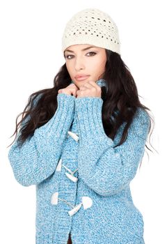 portrait of a young black hair woman in a blue wool sweater, isolated on white background