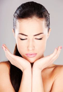 Portrait of a pretty young woman with closed eyes