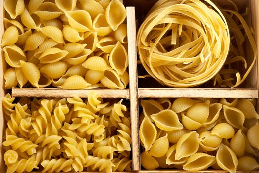 Set of four varieties of pasta in a wooden box